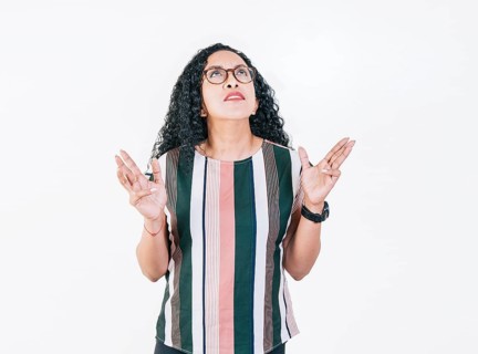 Young woman screaming with her hands in the air. Frustrated girl screaming with hands in the air