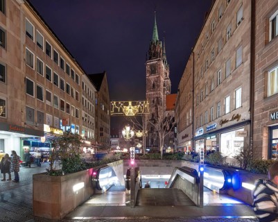 Evening Königstraße with subway entrance and St. Lorenz church in Advent lighting, Nuremberg,