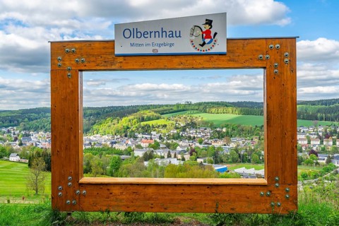View through a large wooden frame for photographers of the town of Olbernhau and surrounding