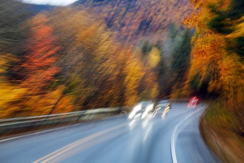 Car, light trails, rain-wet road, curvy country road, autumn leaves, Indian summer, smudge effect,