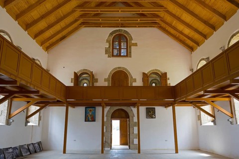 Spacious church interior with distinctive wooden ceiling and windows. Light flows through