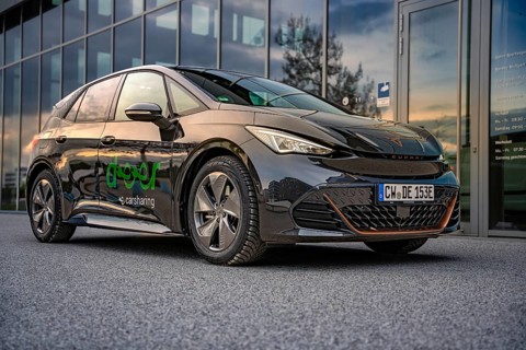 Car at dusk with reflection in a parking lot, Deer E-Car Sharing, Cupra electric car, Böblingen,