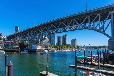 Granville street bridge dominating the vancouver skyline, connecting downtown to granville island