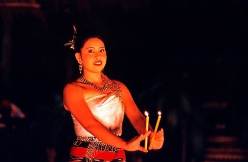 Young woman performing a traditional candle dance, Ko Phuket, Thailand, December 2002, vintage,