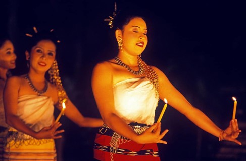 Young woman perform a traditional candle dance, Ko Phuket, Thailand, December 2002, vintage, retro,