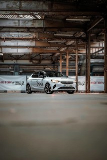 Opel car sharing vehicle parked in empty industrial building, Deer E-Car Sharing, Motorworld