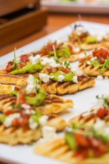 Fried gaufres with avocado and tomatoes on a white plate, Christmas party Dekra Congresshotel Wart,