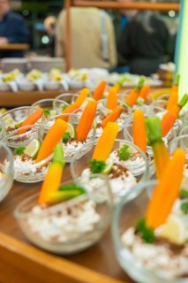 Glasses with decorative carrot garnish, elegantly placed for guests, Christmas party Dekra