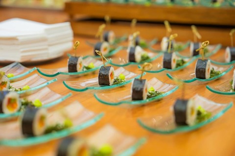 Sushi presentation on elegant glass plates for an exclusive buffet, Christmas party Dekra