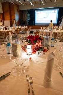 An elegantly set table with Christmas decoration and candle light, Christmas party Dekra