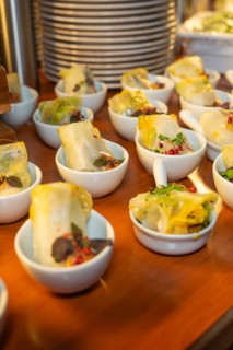 Warm dim sum in small bowls, garnished with spices, Christmas party Dekra Congresshotel Wart, Calw