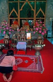 Believers pray at Wat Chalong monastery, Ko Phuket, Thailand, December 2002, vintage, retro, old,