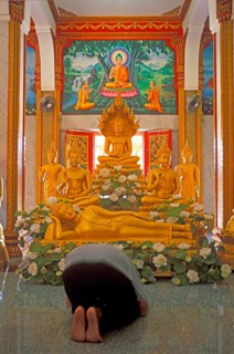 Believer praying, Wat Chalong monastery, Ko Phuket, Thailand, December 2002, vintage, retro, old,