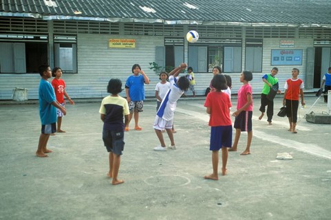 Students in a schoolyard in the stilt village of Ko Pannyi in Phangnga Bay near Ko Phuket, two