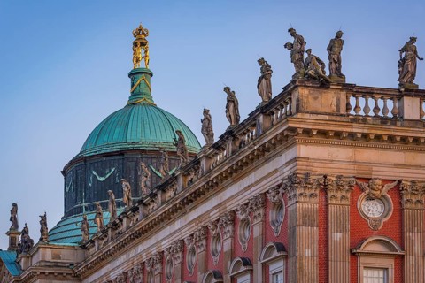Figures and statues at the new palace in Sanssouci Park in the evening light, Potsdam