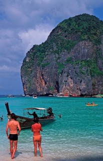 People, longtail boat on Maya Bay beach, known from the movie The Beach, one year in front of the