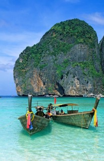 Longtail boats on Maya Bay beach, known from the movie The Beach, one year in front of the tsunami,