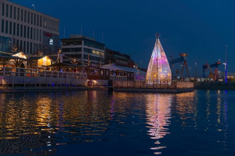 Christmas decoration in Kiel at the boat harbor, festive lighting, glow of lights, evening,