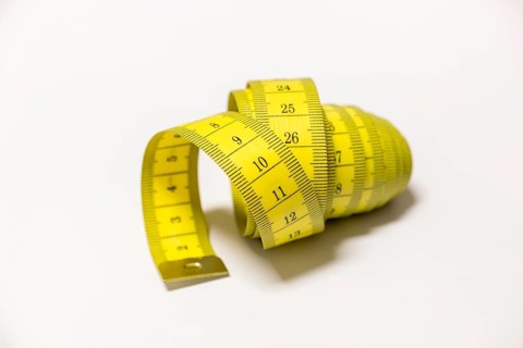 Yellow tape measure rolled into a spiral shape, Germany