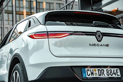 Rear view of a white Renault Megane with highlights on the design of the rear lights, Deer
