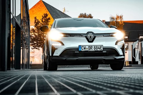 Renault car with headlights on in an evening cityscape, Deer e-car sharing, Renault Megane, Calw,