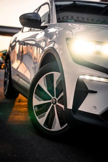 Front view of a car with shiny headlights in an urban environment, Deer E-Carsharing, Renault