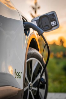 Electric car is charged at a charging station during autumn sunset, Deer e-Carsharing, Renault