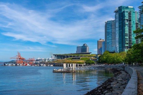 Modern skyscrapers rising along vancouver's waterfront create a stunning cityscape, bustling with