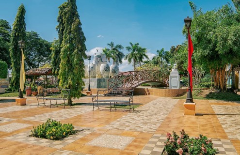 A nice and relaxed park with a wooden bridge over a water fountain, Traditional park of Nagarote,