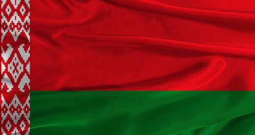 Flag of Belarus with fabric textured background. Close up of National flag of Belarus with