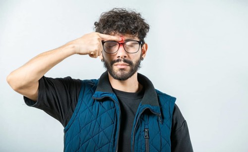 Man with nasal bridge pain on white background. Person with nasal bridge ache isolated