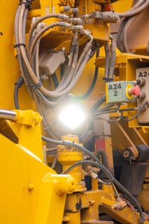 Detailed view of hydraulic lines and technical components of a machine, tamping machine on Hermann,