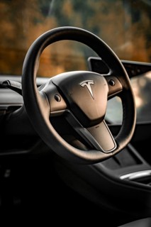 Close-up of a Tesla steering wheel in a modern interior, Deer e-Carsharing, Tesla Model 3, Calw,