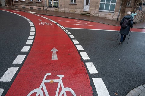 Red marked bicycle path in the city center, Fürth, Middle Franconia, Bavaria, Germany