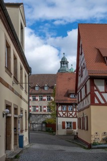 Historic half-timbered houses from 1592, in the back the former castle, built in the 16th century,