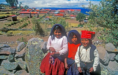 Children wearing traditional clothes on Isla Taquile in Lake Titicaca, Andean Highlands, Peru,