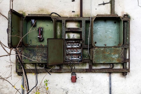Old power box, dilapidated plant of a former agricultural production cooperative of the former GDR,
