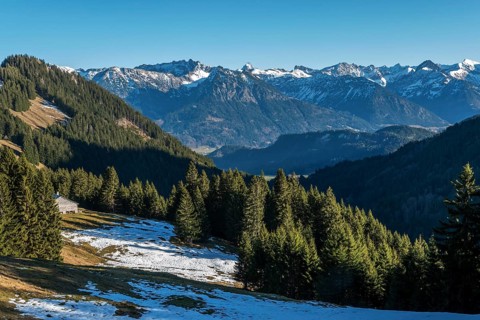 View from the high-altitude hiking trail from Bolsterlanger Horn to Riedberger Horn, snow-capped