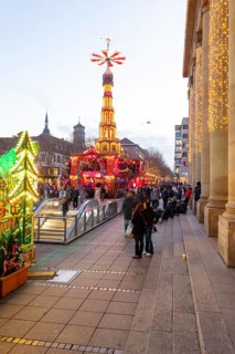 Stuttgart 2025 Christmas market on Schlossplatz with festive lights, a Christmas pyramid, mulled