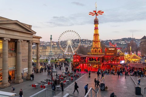 Stuttgart 2025 Christmas market on Schlossplatz with festive lights, a Christmas pyramid, mulled