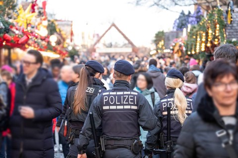 Three police officers are patrolling the Stuttgart 2025 Christmas market. Their presence ensures