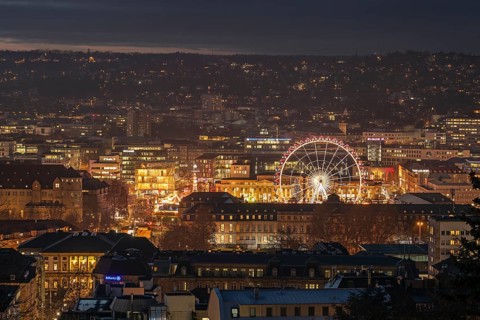 The view from above of the Stuttgart 2025 Christmas market with the Ferris wheel shows a sea of