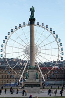 Stuttgart offers a cozy atmosphere in the evening with a view of the illuminated Ferris wheel with