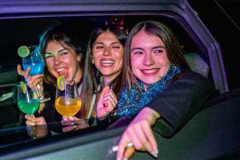 Young women friends smiling and having fun during a lively new year's eve party or celebration,