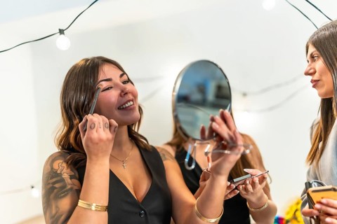 Young diverse women enjoying a fun time together, preparing for a special occasion party at home by