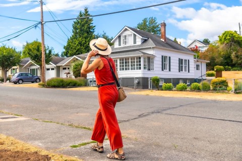 Tourist walking in a residential area of chemainus, a small town on vancouver island, british