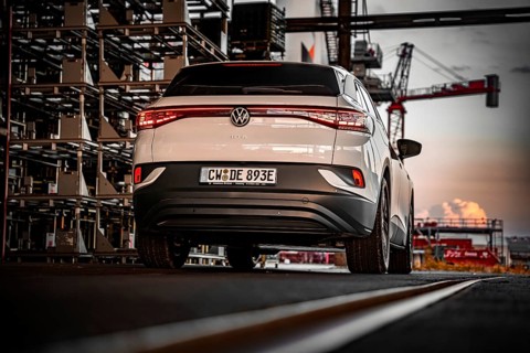White car against an urban backdrop at sunset, VW ID4 electric car, Deer Carsharing, Calw, Germany