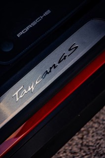 Close-up of a Porsche Taycan 4S emblem with focus on lettering and texture, Porsche Taycan, Deer