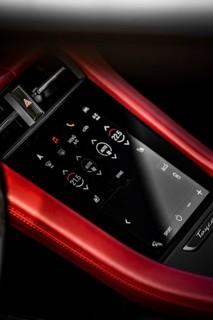 Close-up of a modern touchscreen control panel in a car with a red border, Porsche Taycan, Deer