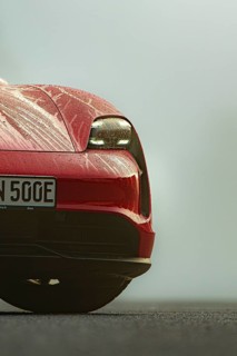 Close-up of a red vehicle with drops of water on the hood, Porsche Taycan, Deer Carsharing, Calw,